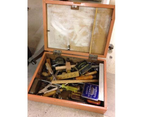 A wooden box of tools