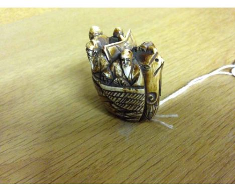 A signed netsuke of a ship.