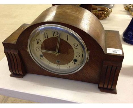 A vintage wooden mantle clock.