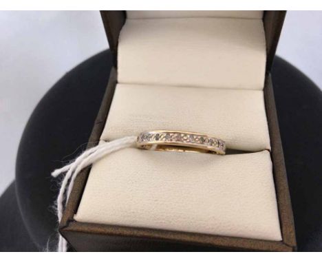 A 9ct gold half eternity ring set with diamonds. Size N.