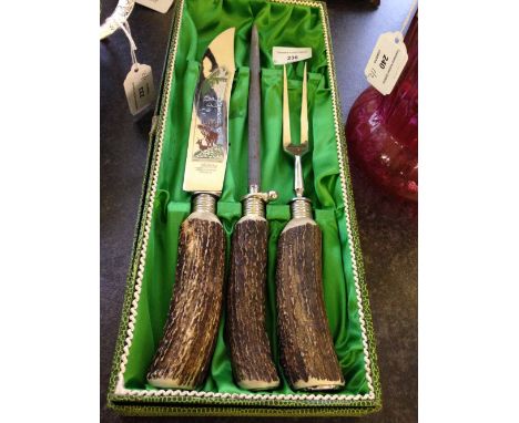 A boxed vintage horn handled carving set by Jublin of Solingen, Germany with stag decoration to blade & fork.
