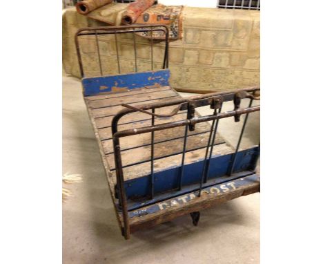 Vintage railway station porters flatbed luggage trolley.