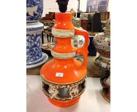 A large West german style orange Fat Lava studio pottery lamp. 55cm tall.