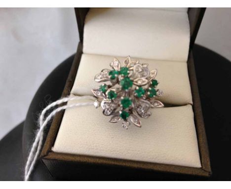 A 14ct white gold diamond & emerald cluster ring set with 22 diamonds and 10 emeralds - size O.