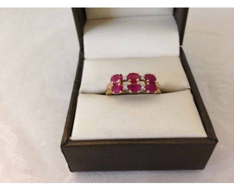 9ct gold ladies dress ring set with 6 oval rubies and 4 small diamonds, size approx P