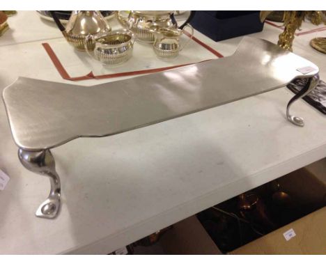 A vintage pewter fire fender
