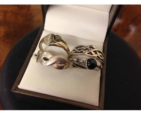 4 ladies silver rings, 2 with Celtic designs, 1 set with a black cabouchon & a signet ring (gold plated)