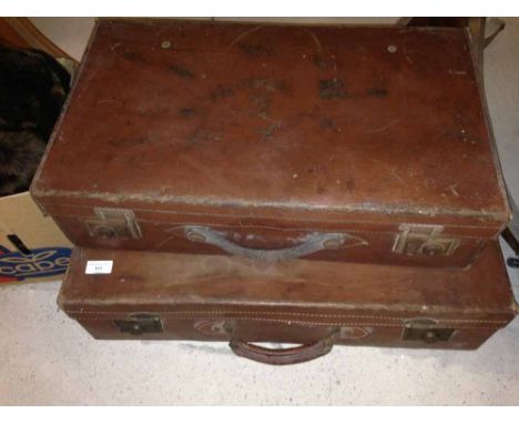 A pair of vintage leather suitcases