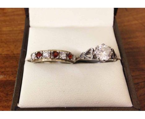 2 pretty silver rings - one a solitaire with open heart shaped shoulder mounts size K, the other a half eternity set with red