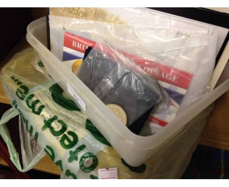 A quantity of mint stamps, first day covers and mint commemortative coins.
