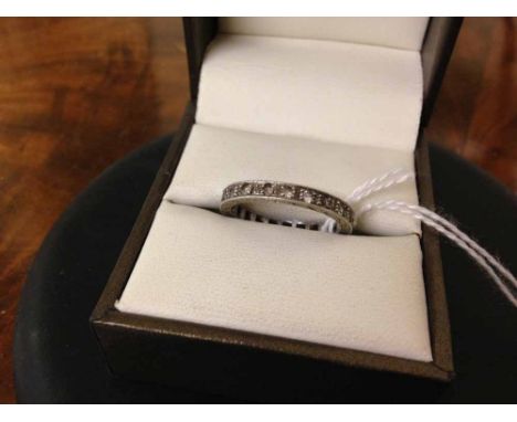 A 9ct white gold eternity ring set with white stones, Size N. Total weight approx 2.5g