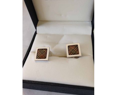A pair of designer Burberry cufflinks.