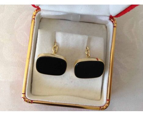 A 14ct gold pair of Onyx cufflinks.