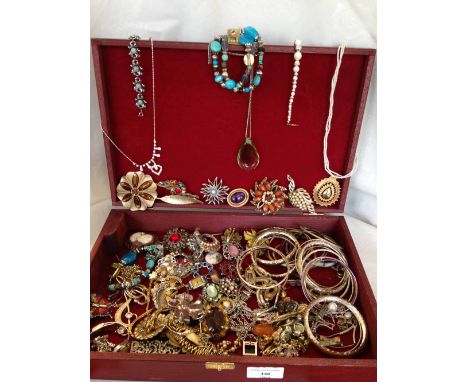 A large lined wooden box containing costume jewellery, much of it vintage items.