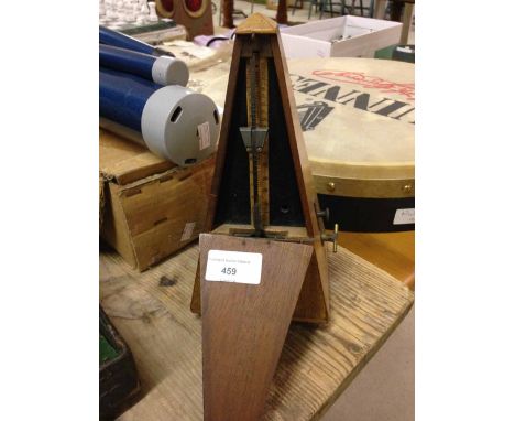 A vintage French metronome in working order.