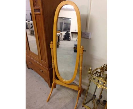 Light wood oval cheval mirror, 150cm tall.