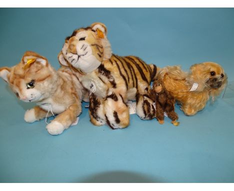 Steiff, four soft toys: Radjah baby tiger, Mizzy, (with buttons and card labels), a miniature monkey with button and a small 