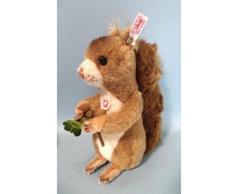 Steiff, a musical squirrel with button, cloth label and one small card label. 