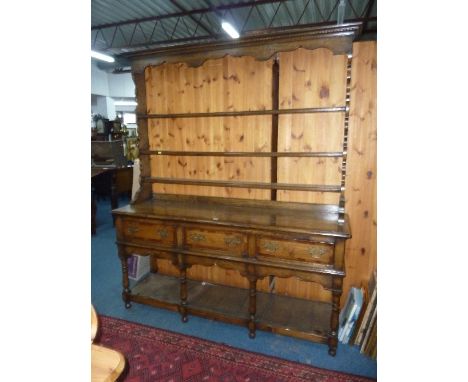 A RECENT OAK AND MAHOGANY CROSSBANDED DRESSER, the three tier plate rack above a three drawer base with lower shelf, approxim