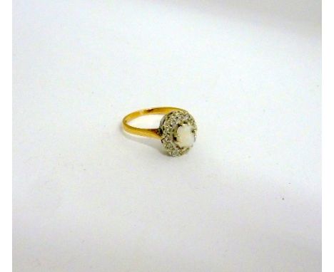 A 9CT GOLD OPAL AND DIAMOND CLUSTER RING, with oval shape opal and single cut diamond surround, hallmarks for Birmingham, rin