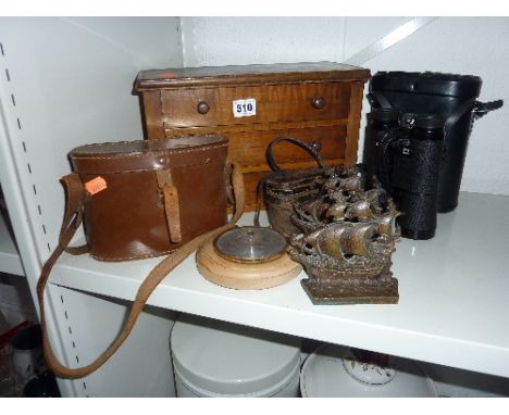 A SMALL VICTORIAN CHEST OF THREE DRAWERS, three pairs of binoculars/opera glasses, a barometer and a pair of bookends (7) 