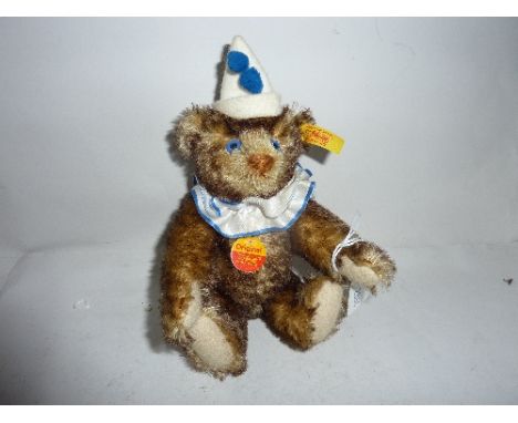 A MINIATURE STEIFF 'TEDDY CLOWN' brown, length approximately 18cm