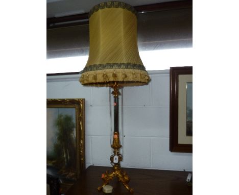 GILT AND EBONISED TABLE LAMP WITH SHADE 