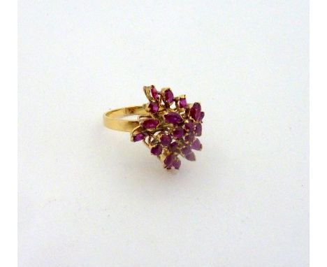 A RUBY CLUSTER DRESS RING, designed as a spray of marquise and round shape rubies to a plain band, ring size N