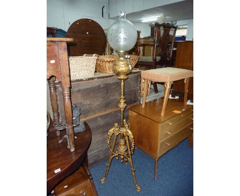 A 19TH CENTURY OIL LAMP, on ornate tripod support with cherub detail (later funnel and shade)