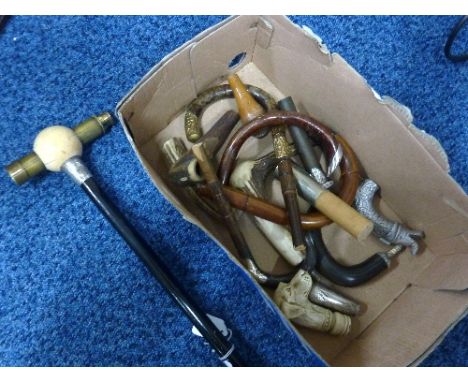 A TAPERING WALKING CANE, with compass mounted telescope pommel together with horn, antler and silver cane mounts (15)