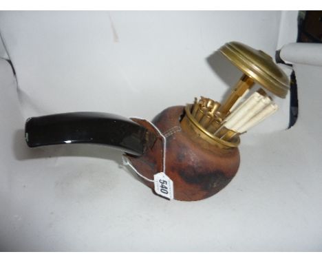 A NOVELTY CIGARETTE DISPENSER, shaped as a large pipe 