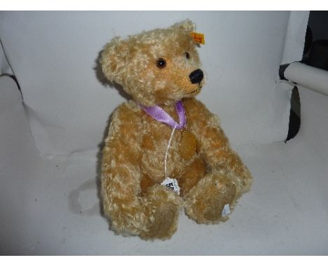 AN UNBOXED STEIFF GOLDEN PLUSH BEAR, a 2003 bear produced exclusively for Danby Mint, complete with medallion, height approxi