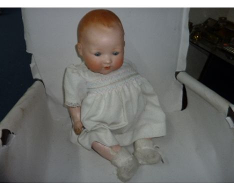 AN  ARMAND MARSEILLE BISQUE HEAD BABY DOLL, nape of neck marked 'A.M. Germany 351. 18.K', sleeping eyes, open mouth with no t