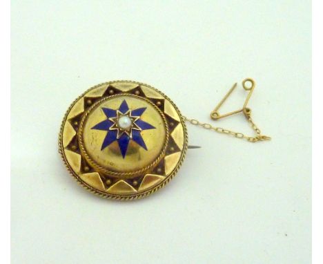 A MEMORIAL BROOCH, with central pearl upon a dome shape, with blue enamel star detail within a border of further larger star 