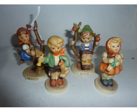FOUR HUMMEL FIGURES 'Apple Tree Boy', 'Apple Tree Girl', 'Girl with Doll' and 'Boy with Horse'