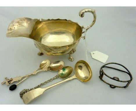 A SILVER SAUCE BOAT on three hoof feet, Birmingham 1906, together with silver napkin ring, Newcastle sauce ladle, coffee spoo