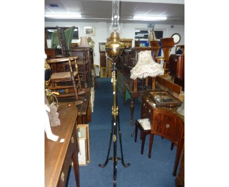 A TELESCOPIC BRASS AND IRON FLOOR STANDING OIL LAMP, with funnel (no shade)