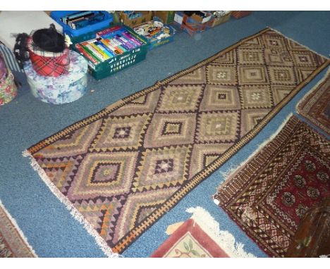 A CARPET RUNNER, approximate size 330cm x 89cm