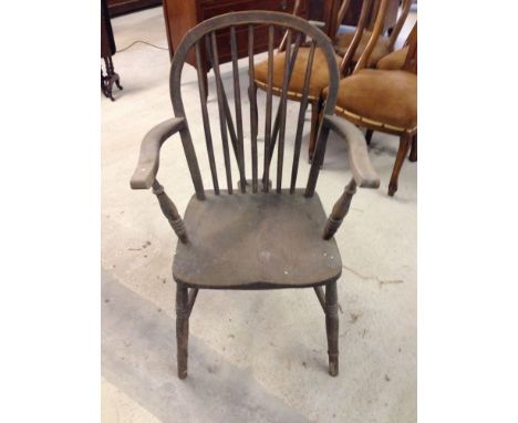 A Victorian stick back farmhouse chair.