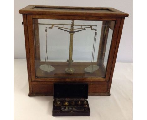 A vintage set of cased scientific weighing scales with a box of weights by W&J George Ltd, Birmingham.