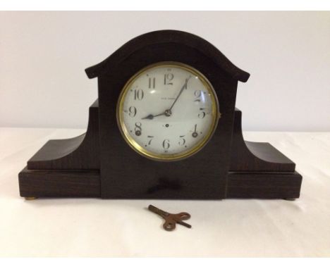 An American Seth Thomas wooden mantle clock with enamel dial.  In need of restoration.