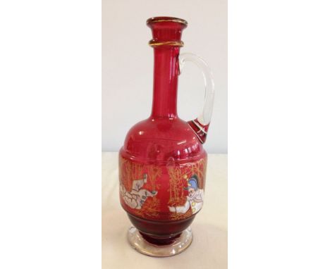 A late 19th/early 20th century Bohemian cranberry glass ewer with raised enamel decoration of a nursery rhyme/children runnin