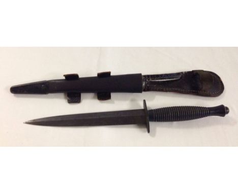 A Fairbairn - Sykes Third Pattern British Commando Knife. Hilt marked 'Willard Rodgers Sheffield, England' with scabbard. Kni