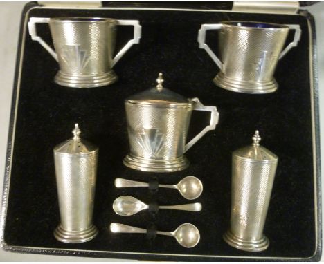 An Art Deco five piece silver condiments set of tapered vase design with engine turned decoration  comprising a pair of twin 