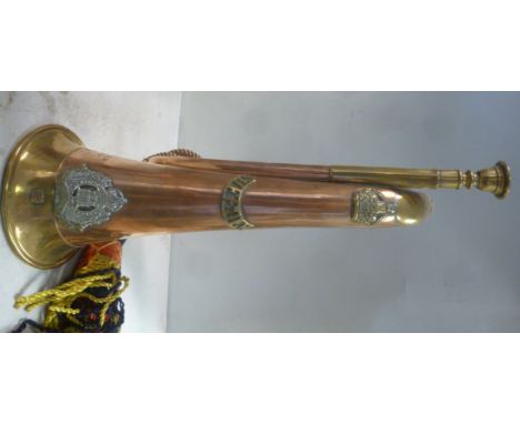 A copper and brass bugle, bears the emblem of The Suffolk Regiment, NT, impressed Suffolk Reg WD and 2569 Bugler N Thacker   