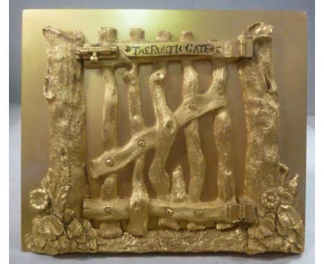 A late Victorian G Betjemann & Sons gilt metal novelty photograph frame, the rectangular plate overlaid with a naturalistical