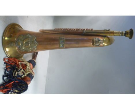 A copper and brass bugle, bears the emblem of the Highland Light Infantry regiment, AN, impressed WD Arras 1917.18 and 3975 B