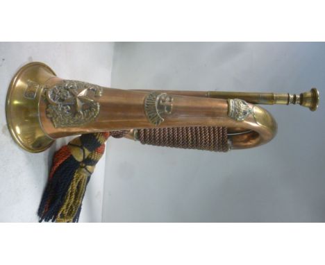 A copper and brass bugle, bears the emblem of the Cameroonians Scottish Rifles regiment, NS, impressed WD CSR and 5997 Bugler
