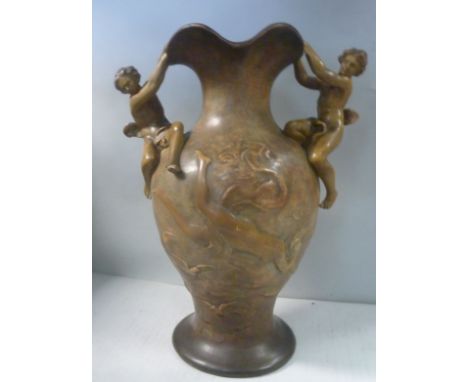 A Goldsheider Art Nouveau terracotta vase of ovoid form, decorated with a nude female figure amongst swirling clouds with bir
