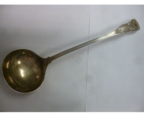 A late Victorian silver King's pattern soup ladle with an oval bowl  bears an engraved armorial  John Round & Son  Sheffield 